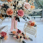 Load image into Gallery viewer, Side view of a handcrafted preserved bridal bouquet with flowing ribbon and layered floral textures