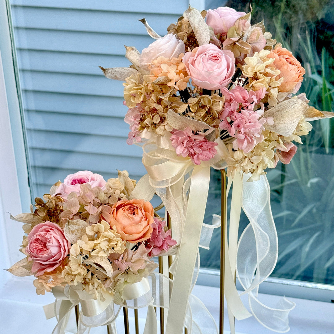 Romantic preserved blush bridal bouquet with matching bridesmaid bouquet in garden style