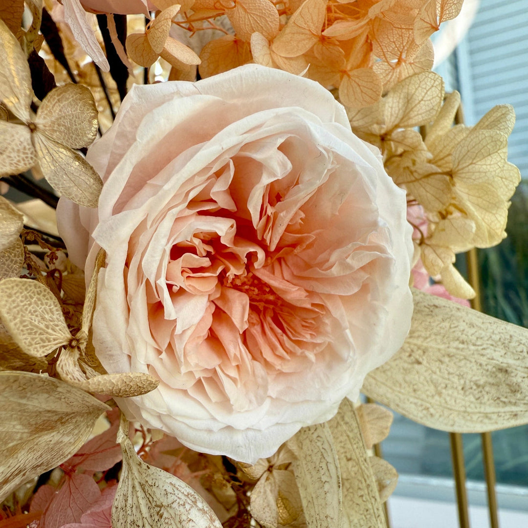 Close-up of preserved champagne roses in bridal bouquet