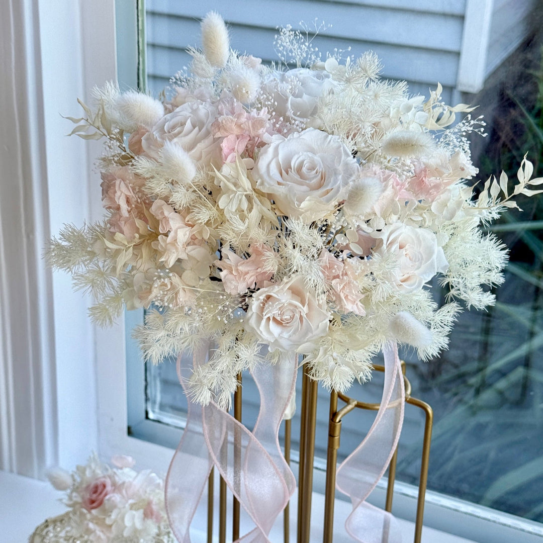 Front view of preserved blush bridal bouquet with soft rounded shape.