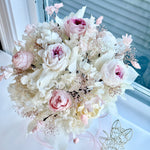Load image into Gallery viewer, Angled view of blushing garden rose preserved bridal bouquet highlighting layered florals