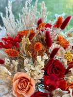 Load image into Gallery viewer, Artistic detail of a bohemian flame preserved bridal bouquet showcasing bold color contrast and organic texture