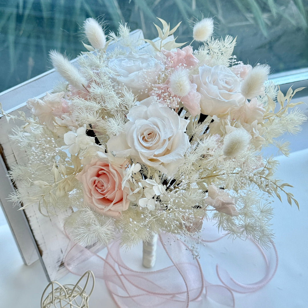 Luxury preserved blush and ivory bridal bouquet with roses and airy textures