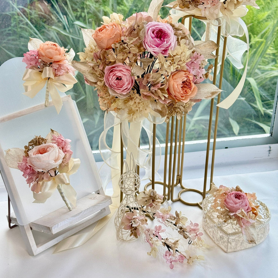 Preserved bridal and bridesmaid bouquet set styled for a romantic wedding ceremony