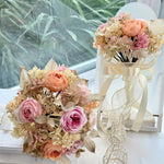 Load image into Gallery viewer, Front view of preserved garden-style bridal bouquet in blush and champagne tones
