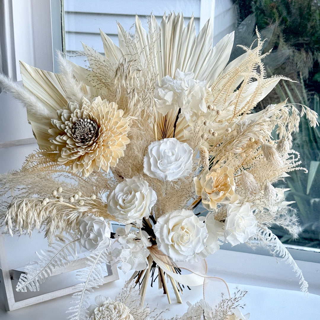 Luxury preserved ivory bridal bouquet with roses, sola flowers and dried palms