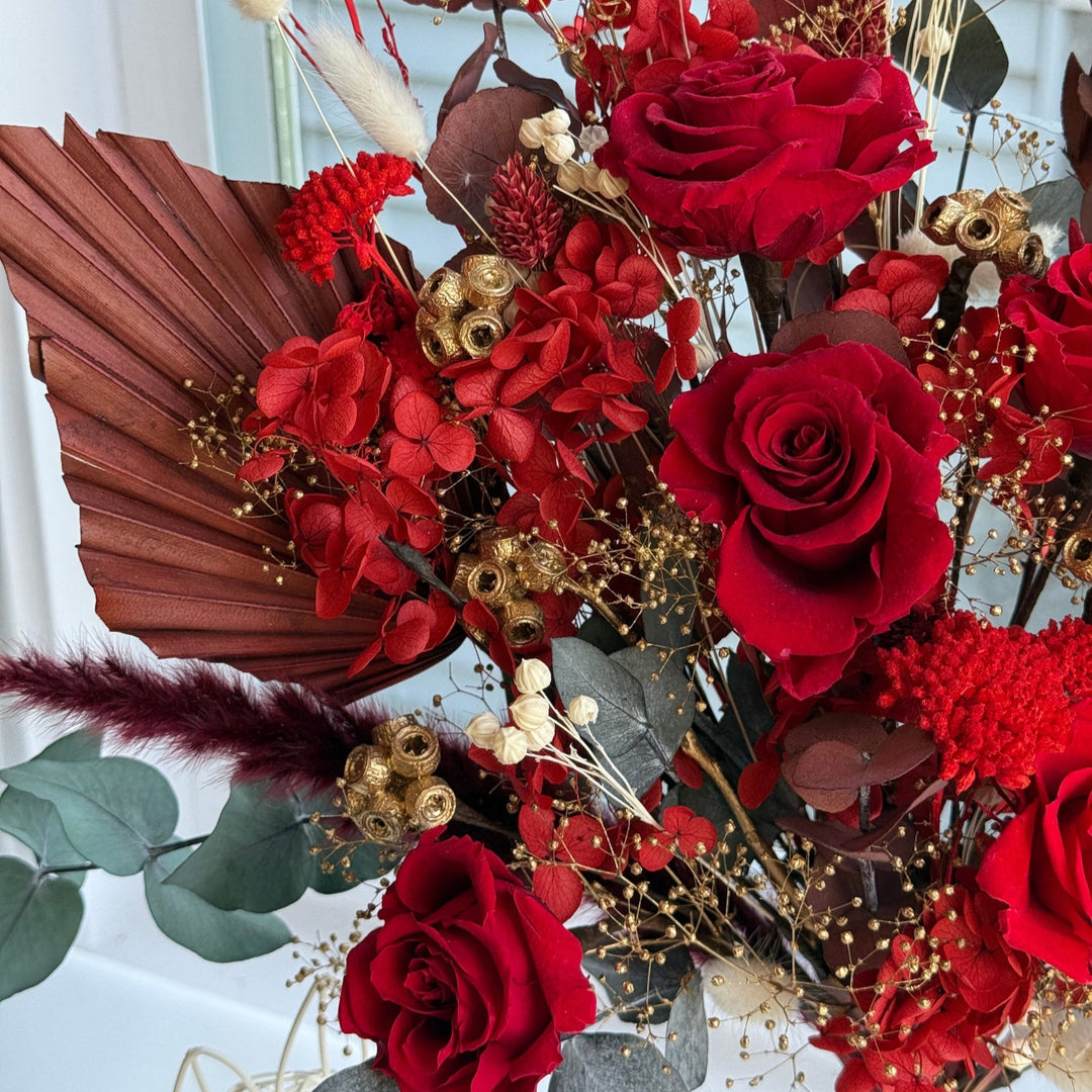 detail of preserved florals and gold accents in luxury wedding