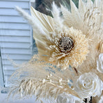 Load image into Gallery viewer, close-up of preserved ivory roses and sola flowers in bridal boquet