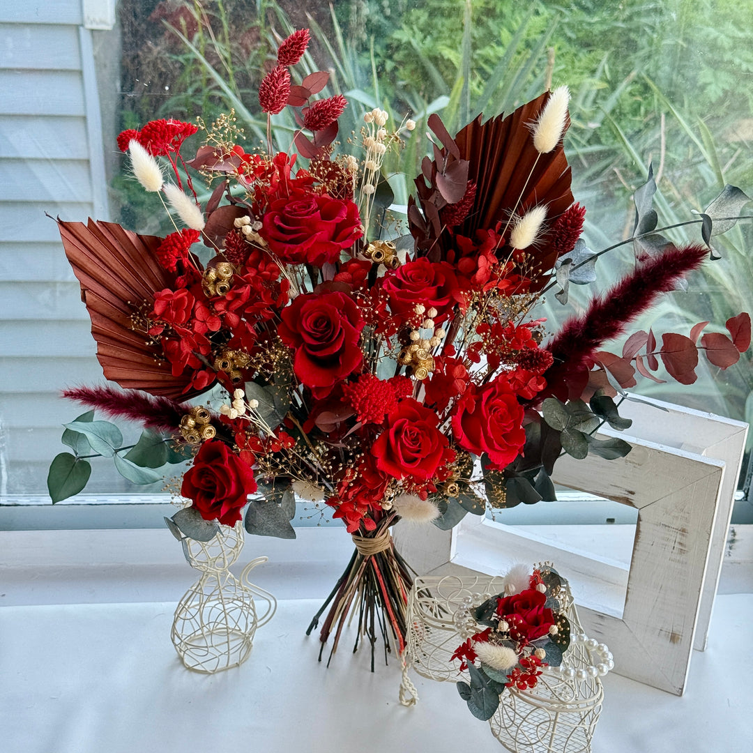 matching preserved corsage with red bridal bouquet
