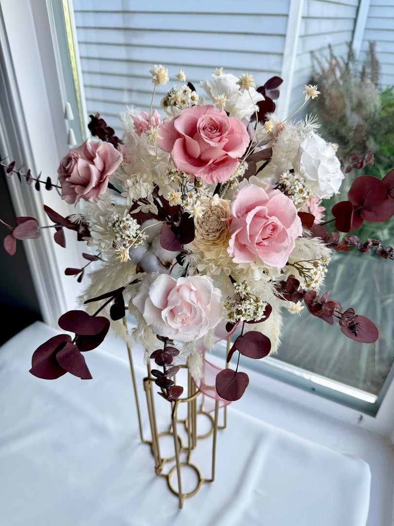 Angled side view of preserved blush rose bridal bouquet showing layered florals and natural movement