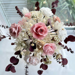 Load image into Gallery viewer, Full view of blush pink preserved bridal bouquet with garden roses, ivory hydrangeas, and burgundy eucalyptus accents