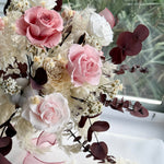 Load image into Gallery viewer, Detail view of preserved ivory hydrangeas and soft filler flowers within the bouquet